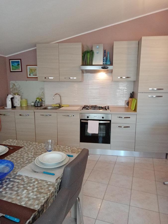 Casa Vacanza Le 2 Isole Suni Bagian luar foto